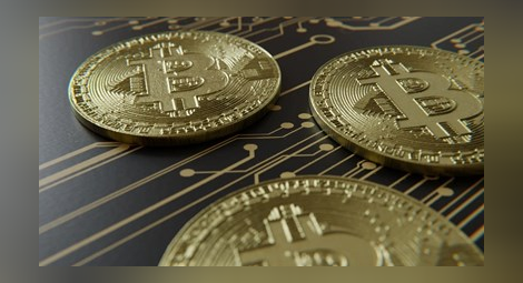 Биткойнът доближи прага от 50 000 долара